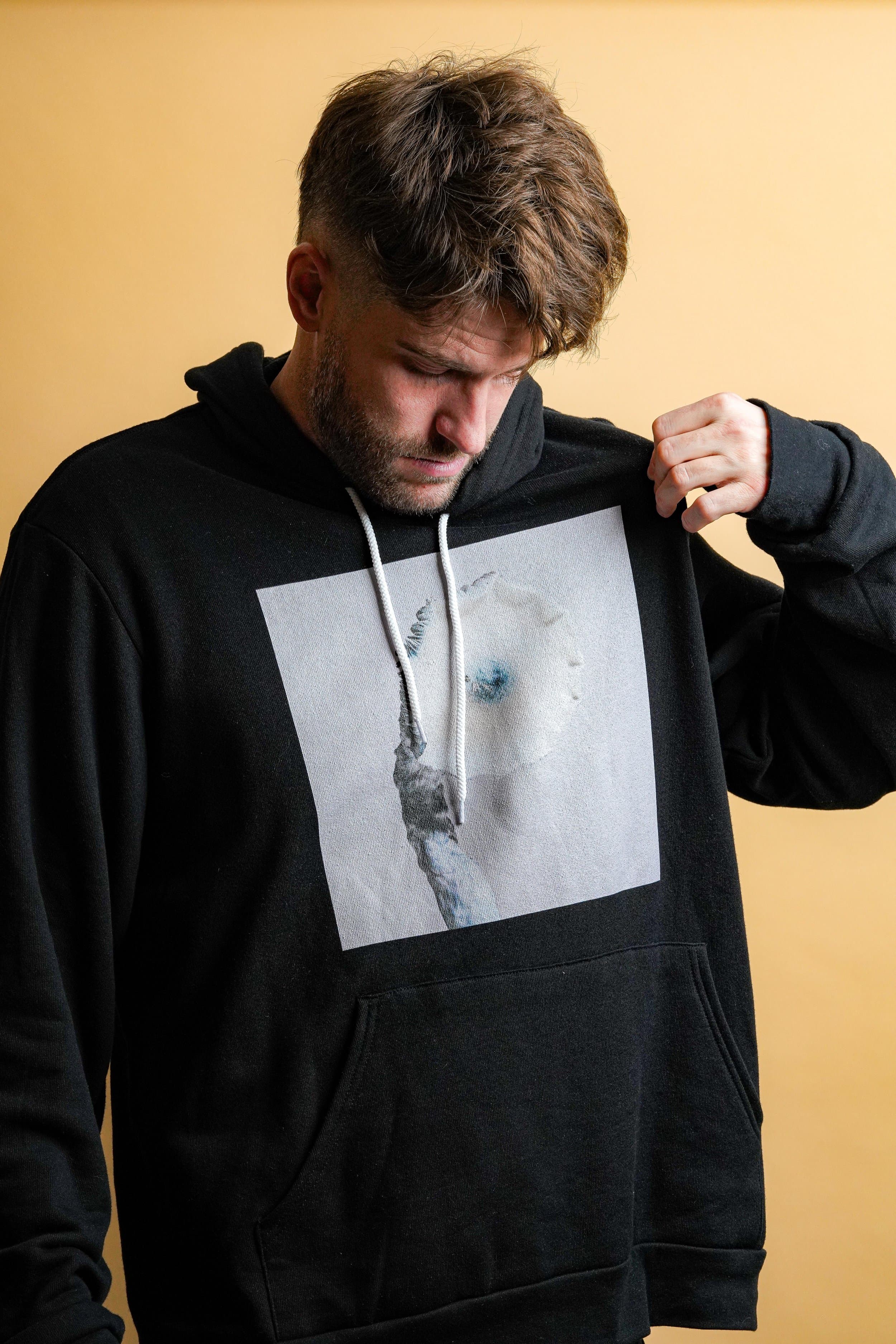 Black hoodie printed with the Jack's Solitude winter mushroom study