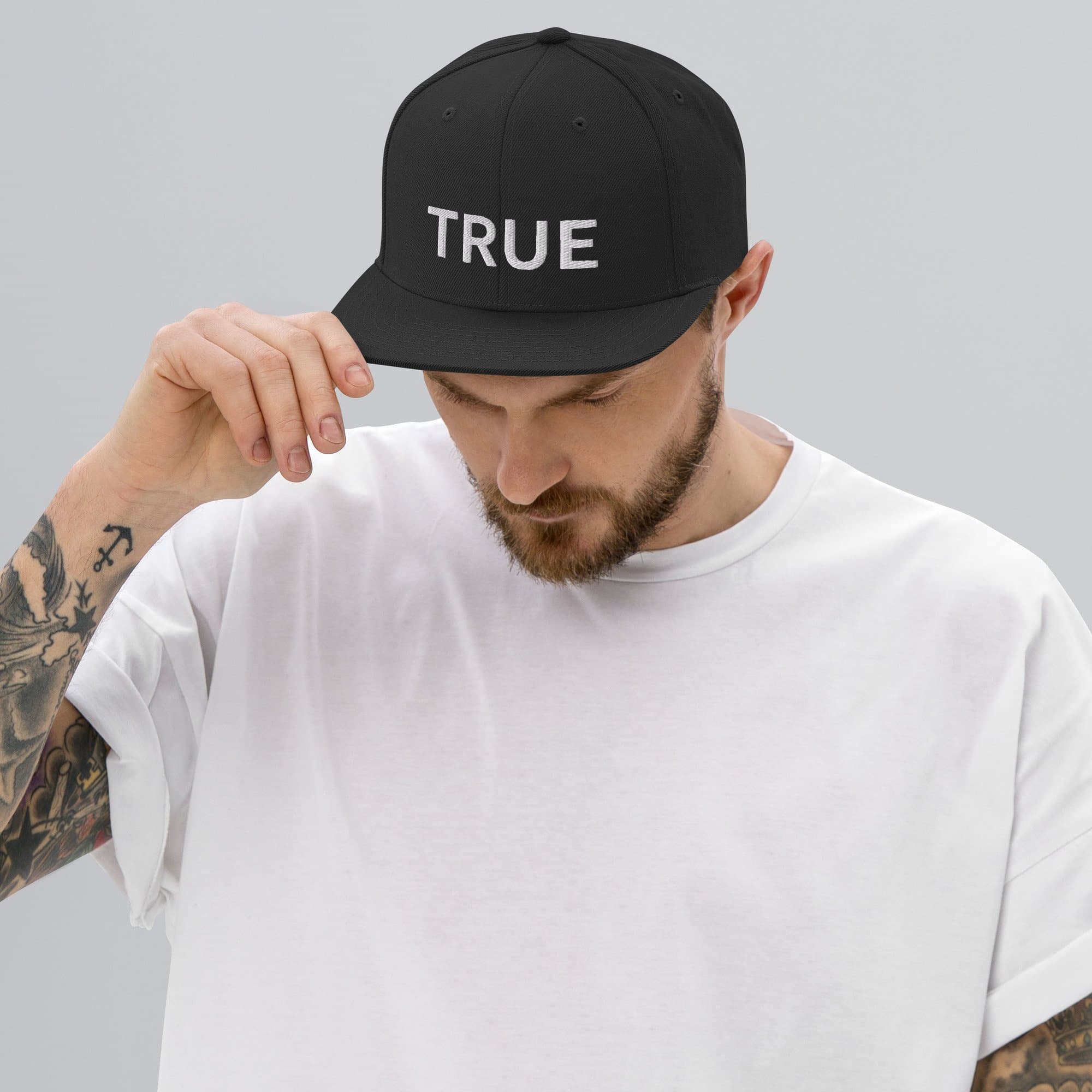 Black snapback with TRUE embroidered in white